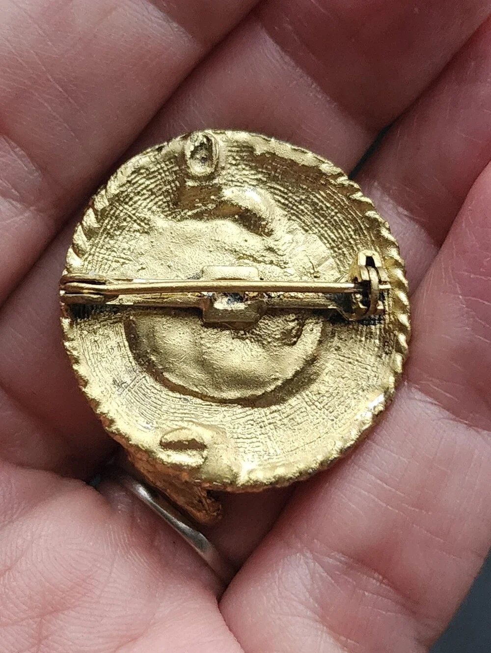 N/A brooch features
